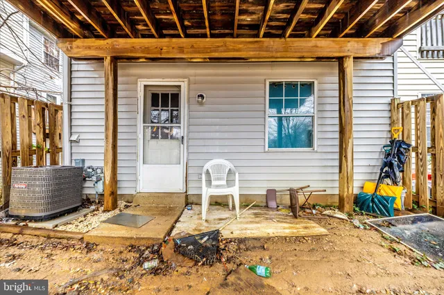 a view of a backyard with wooden fence