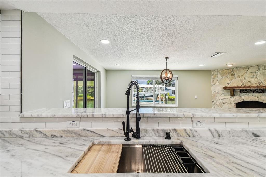 13909 Berkowitz Avenue Hudson, FL 34667 - Photo 11 of 91 a kitchen with a sink and a stove top oven