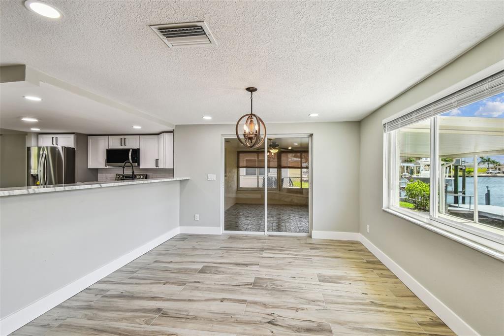 13909 Berkowitz Avenue Hudson, FL 34667 - Photo 18 of 91 a view of a kitchen with furniture and windows