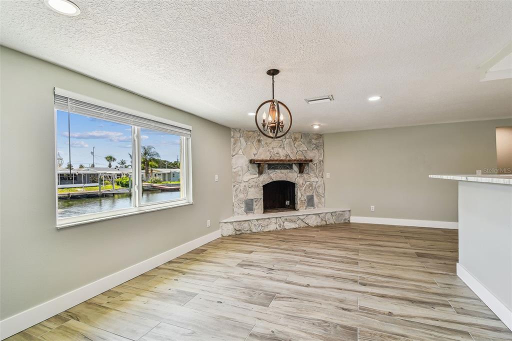 13909 Berkowitz Avenue Hudson, FL 34667 - Photo 20 of 91 a view of an empty room with window and wooden floor