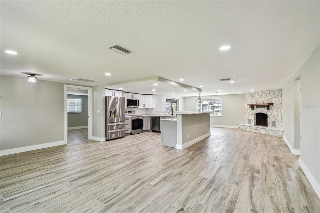 13909 Berkowitz Avenue Hudson, FL 34667 - Photo 25 of 91 a view of kitchen with cabinets and wooden floor