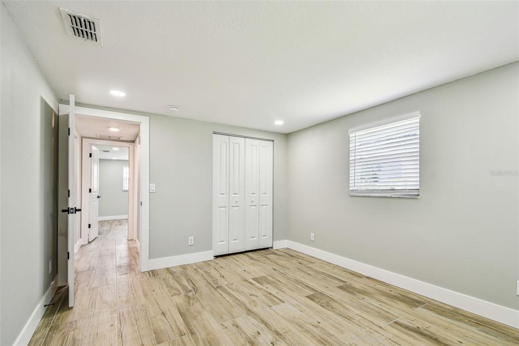 13909 Berkowitz Avenue Hudson, FL 34667 - Photo 37 of 91 wooden floor in an empty room
