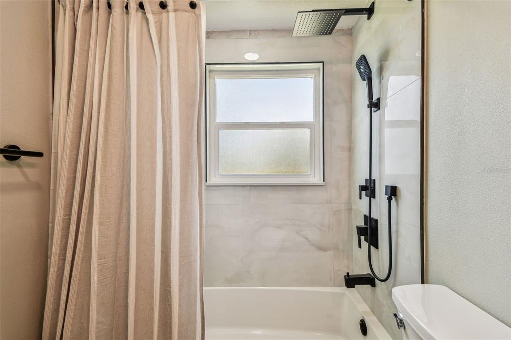 13909 Berkowitz Avenue Hudson, FL 34667 - Photo 43 of 91 a bathroom with a bathtub and a shower