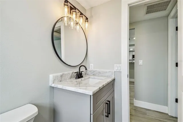 an aerial view of a house with a lake view