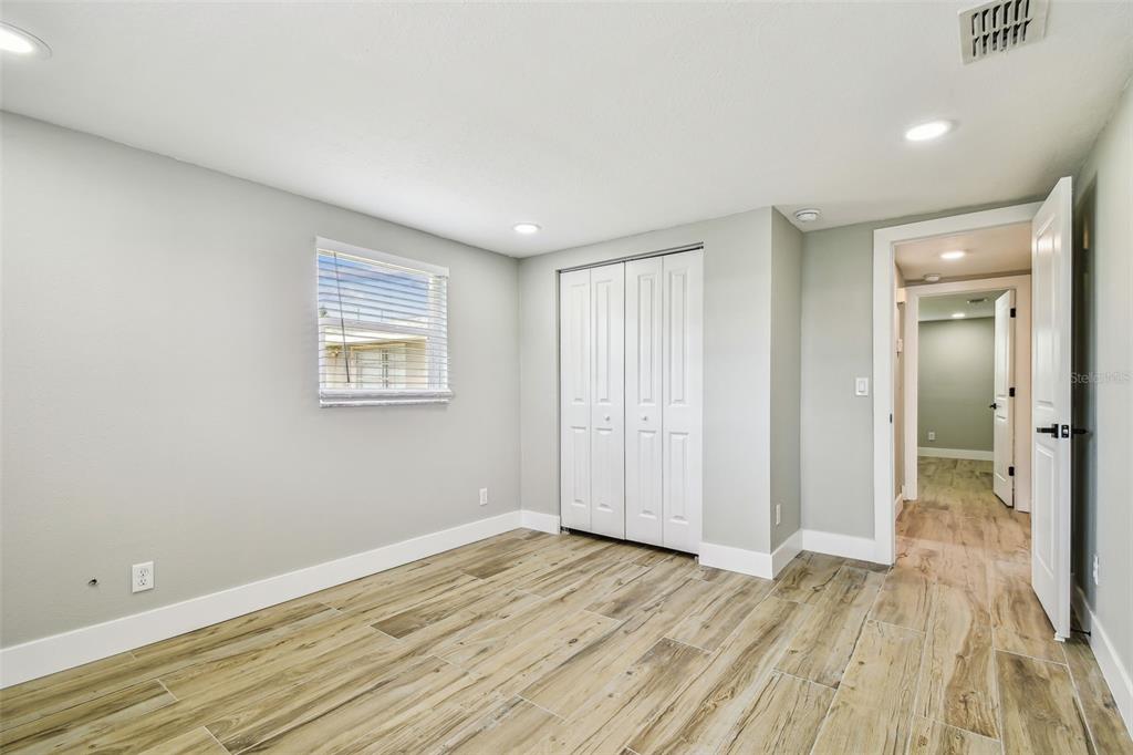 13909 Berkowitz Avenue Hudson, FL 34667 - Photo 46 of 91 a view of a room with wooden floor and bathroom