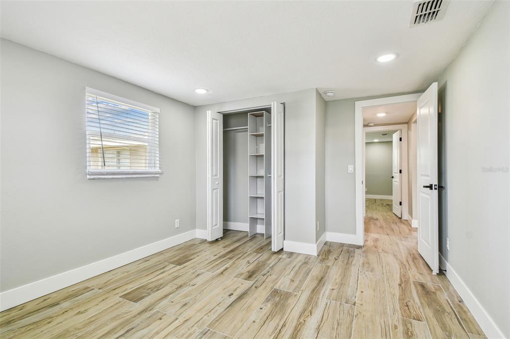 13909 Berkowitz Avenue Hudson, FL 34667 - Photo 49 of 91 a view of a room with wooden floor and bathroom