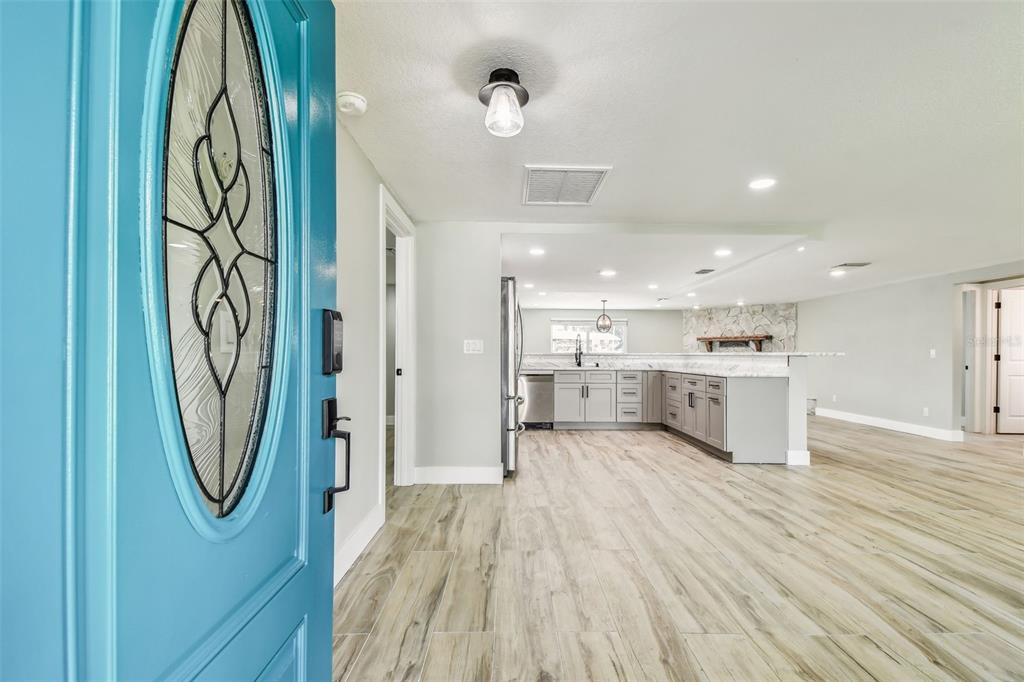 13909 Berkowitz Avenue Hudson, FL 34667 - Photo 6 of 91 a view of a hallway with wooden floor