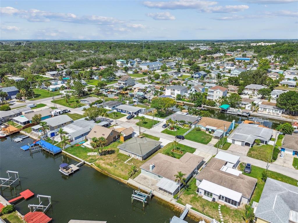 13909 Berkowitz Avenue Hudson, FL 34667 - Photo 84 of 91 an aerial view of residential houses with outdoor space