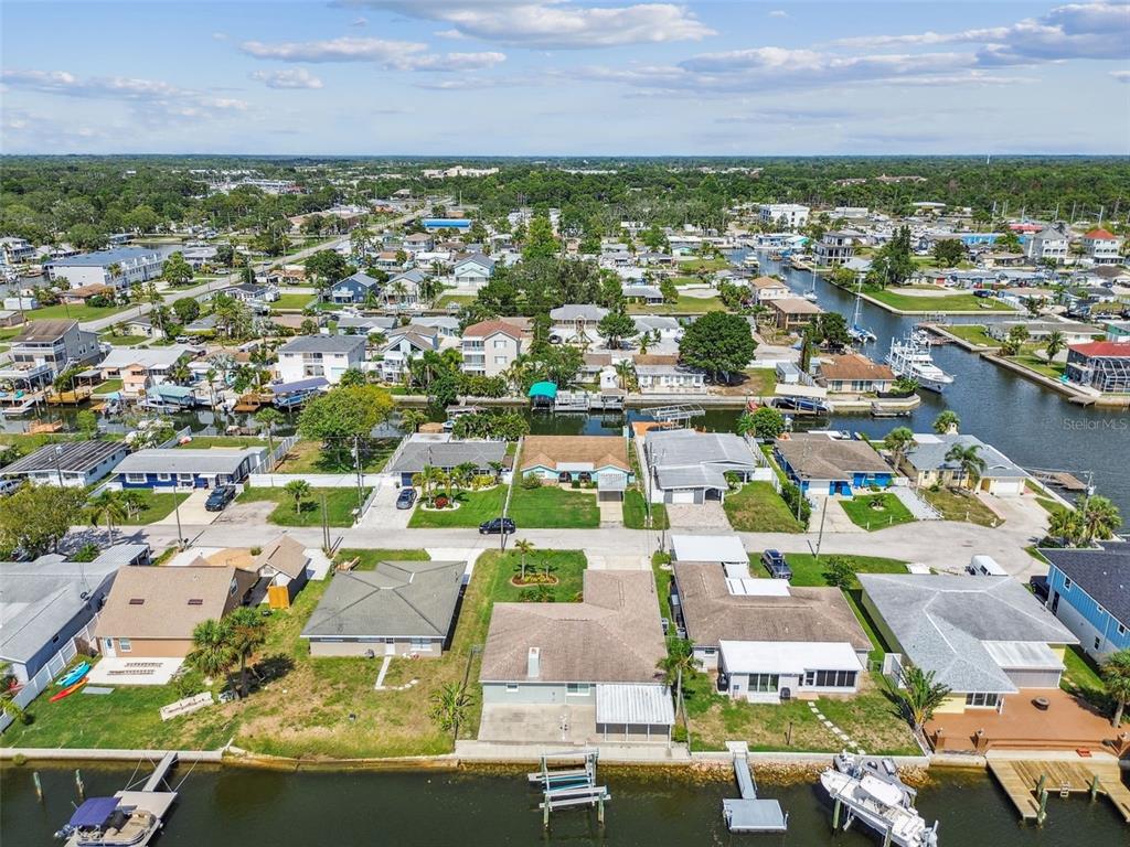 13909 Berkowitz Avenue Hudson, FL 34667 - Photo 85 of 91 an aerial view of residential houses with outdoor space