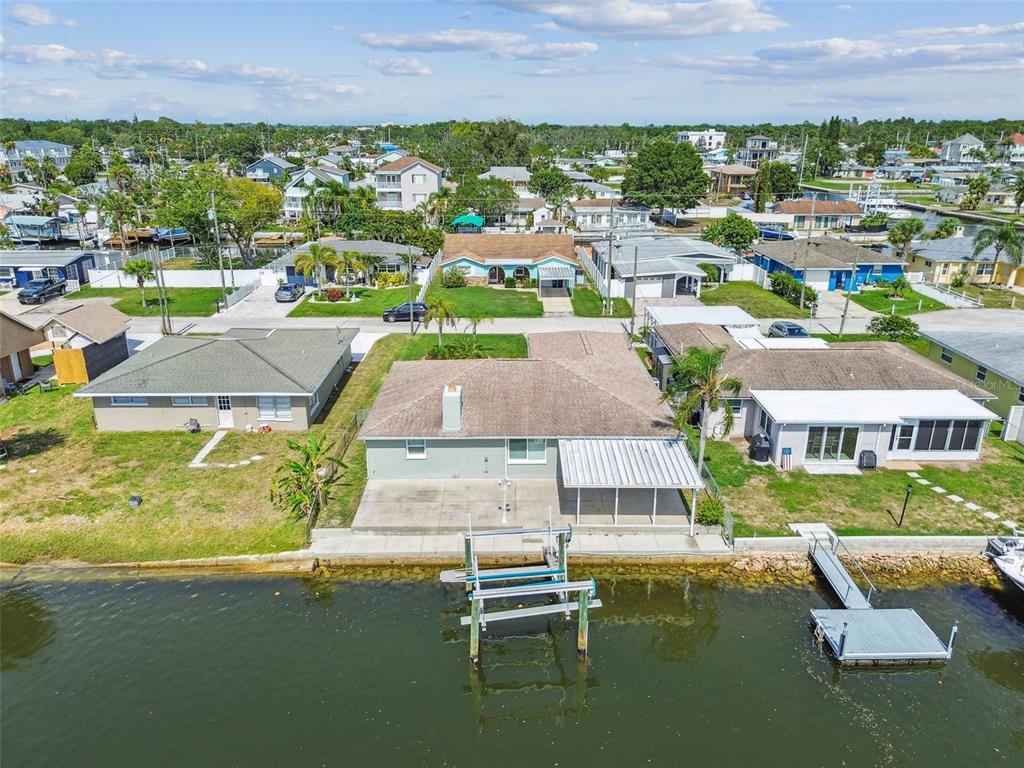 13909 Berkowitz Avenue Hudson, FL 34667 - Photo 88 of 91 an aerial view of residential houses with outdoor space