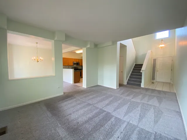 a view of a livingroom with a staircase