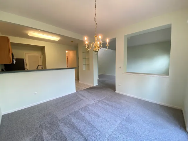 a view of a hallway with a chandelier