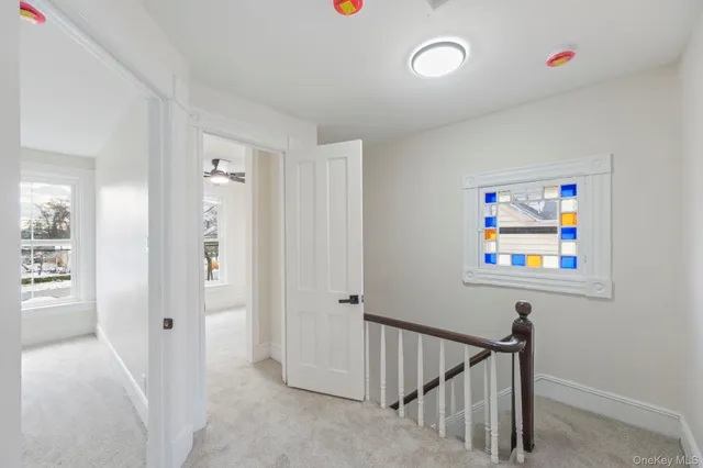 a view of an entryway with wooden floor