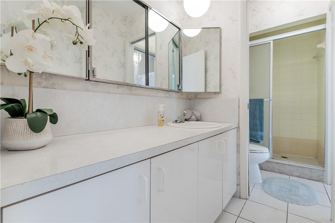 601 Northwest 12th Avenue Boca Raton, FL 33486 - Photo 15 of 27 a bathroom with a sink a vanity and a mirror