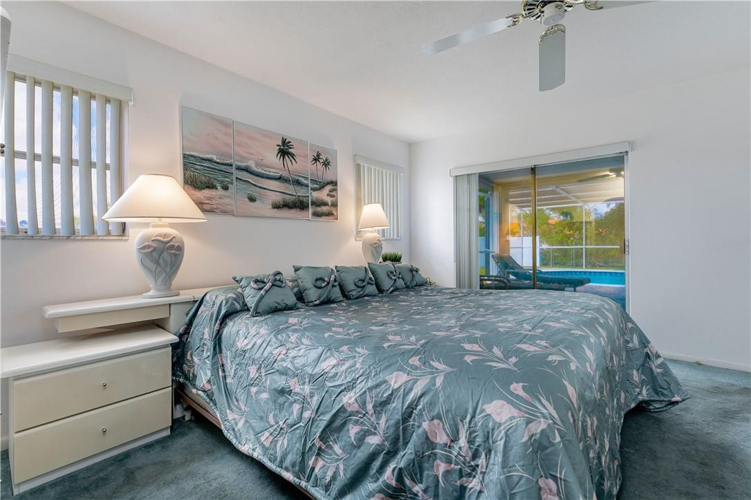 601 Northwest 12th Avenue Boca Raton, FL 33486 - Photo 17 of 27 a bedroom with a bed and a window