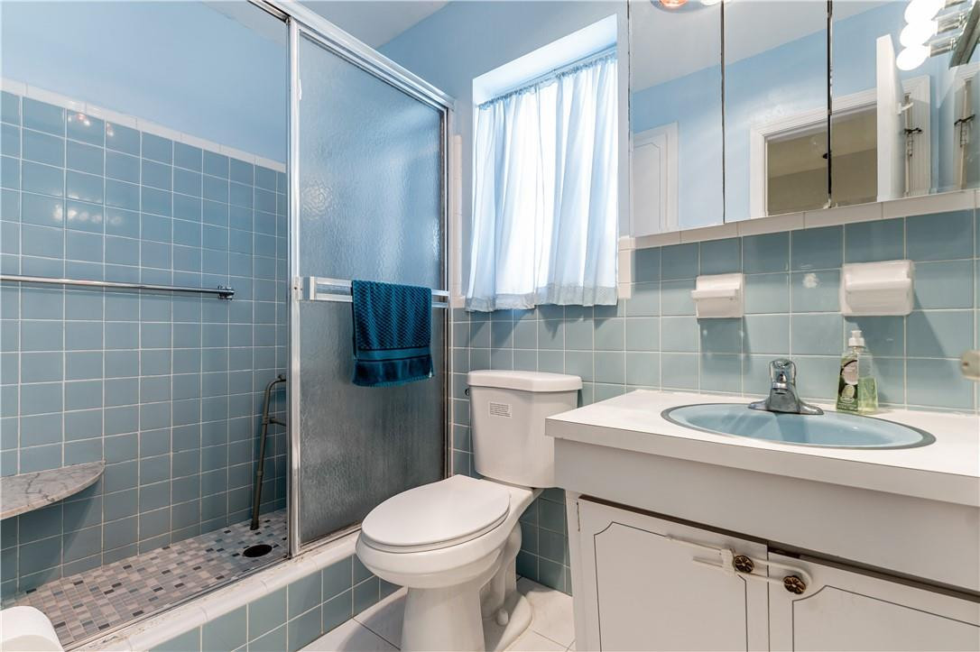 601 Northwest 12th Avenue Boca Raton, FL 33486 - Photo 18 of 27 a bathroom with a sink a toilet and shower