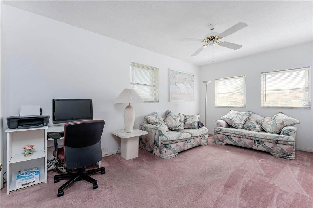 601 Northwest 12th Avenue Boca Raton, FL 33486 - Photo 20 of 27 a living room with furniture and a window