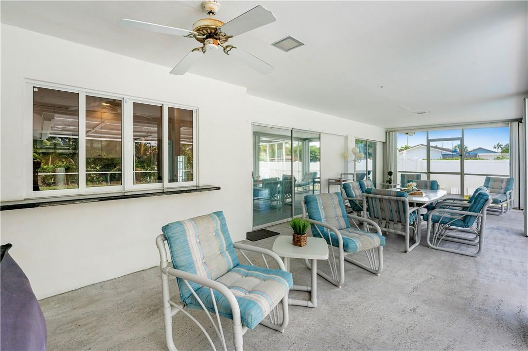 601 Northwest 12th Avenue Boca Raton, FL 33486 - Photo 24 of 27 a living room with furniture and a window