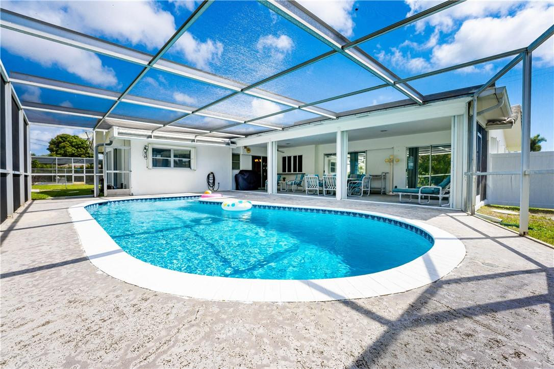 601 Northwest 12th Avenue Boca Raton, FL 33486 - Photo 25 of 27 a view of a swimming pool with a patio