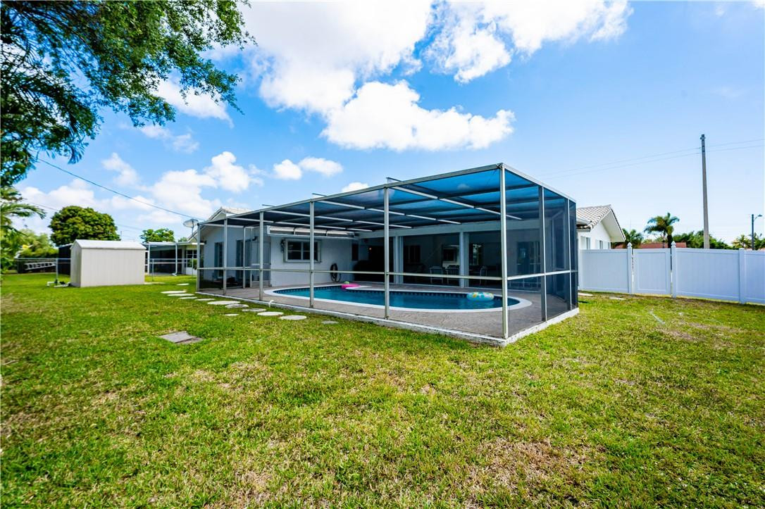 601 Northwest 12th Avenue Boca Raton, FL 33486 - Photo 26 of 27 a view of a house with backyard and garden
