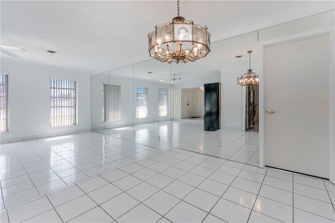 601 Northwest 12th Avenue Boca Raton, FL 33486 - Photo 7 of 27 an empty room with projector and furniture