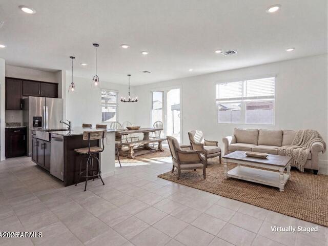 17629 West Madison Street Goodyear, AZ 85338 - Photo 6 of 46 Great Room / Kitchen Virtually Staged