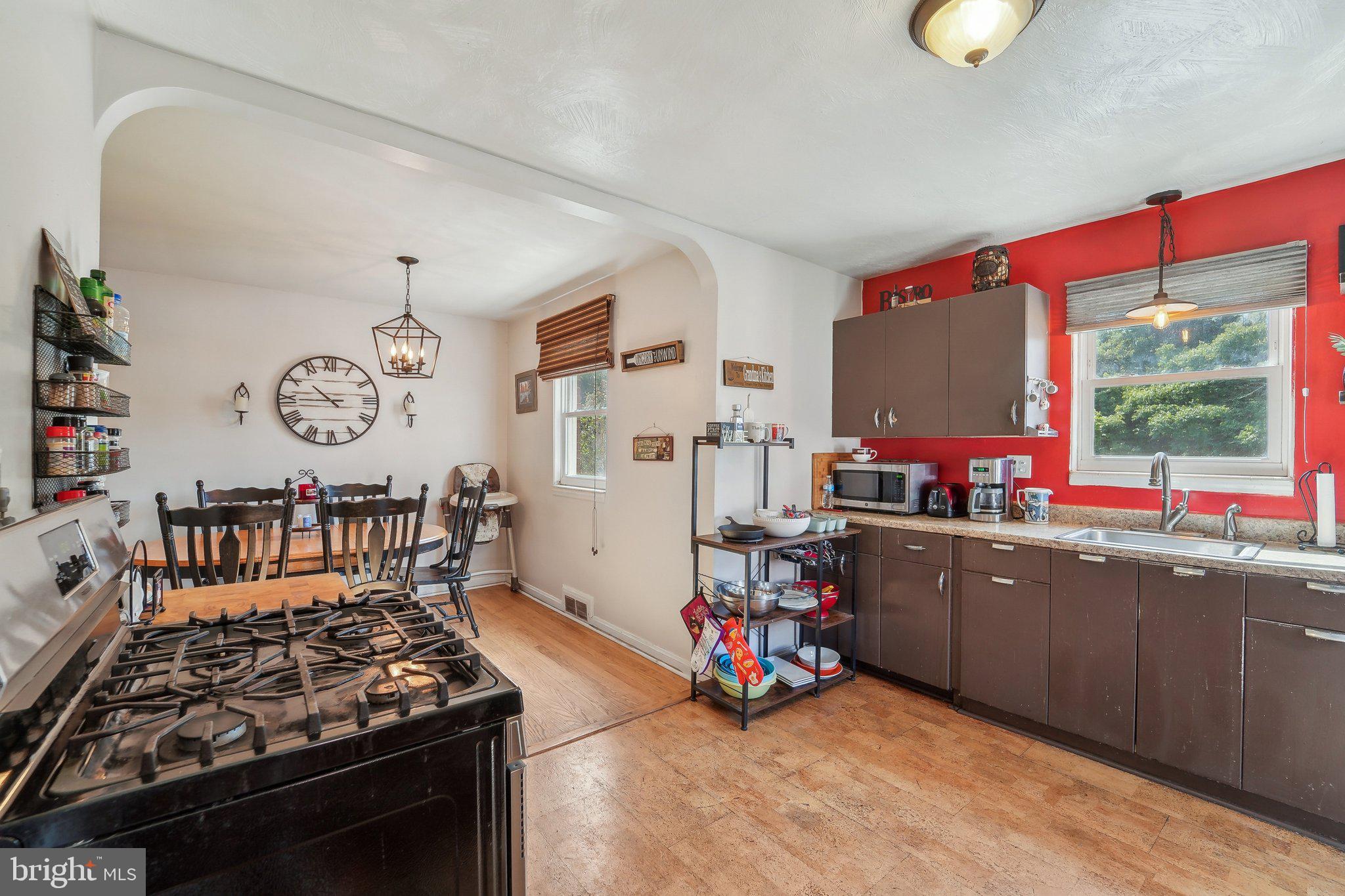 414 Biggs Avenue Frederick, MD 21702 - Photo 12 of 27 a kitchen that has a lot of cabinets a sink and a stove