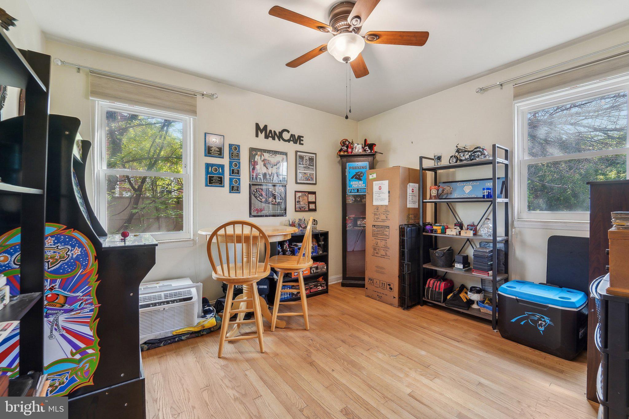 414 Biggs Avenue Frederick, MD 21702 - Photo 14 of 27 a living room with furniture and a flat screen tv