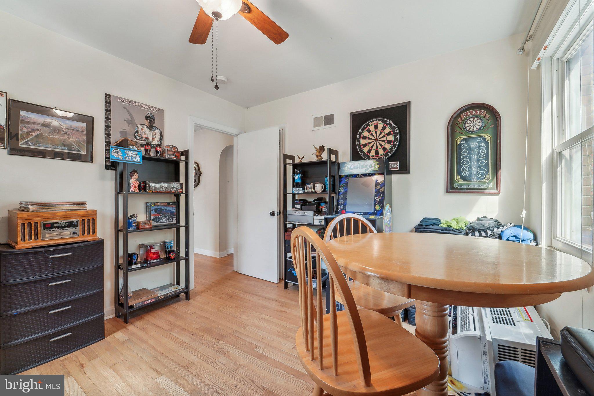 414 Biggs Avenue Frederick, MD 21702 - Photo 15 of 27 a dining room with furniture and wooden floor