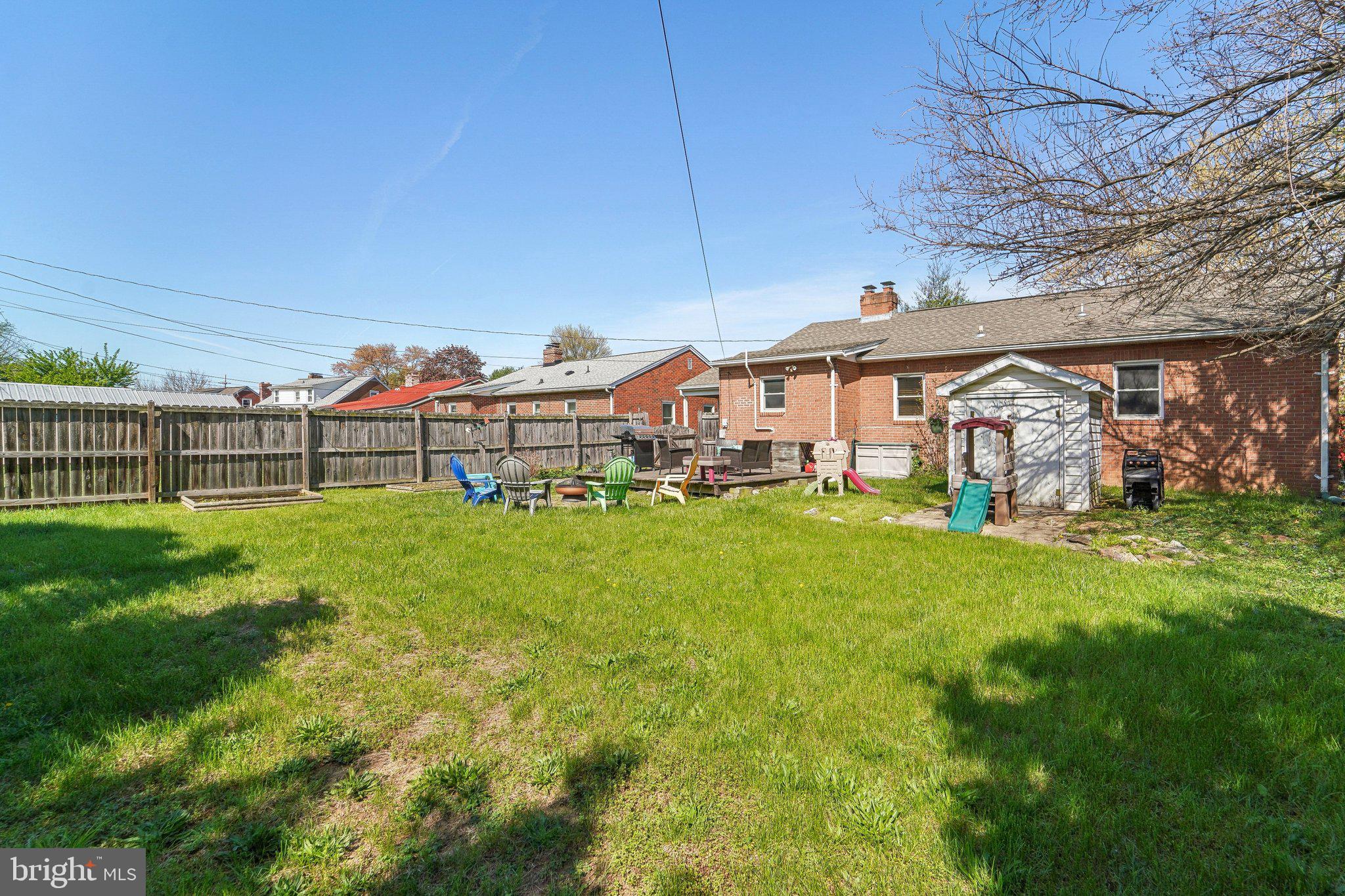 414 Biggs Avenue Frederick, MD 21702 - Photo 26 of 27 a view of a house with a big yard and sitting area