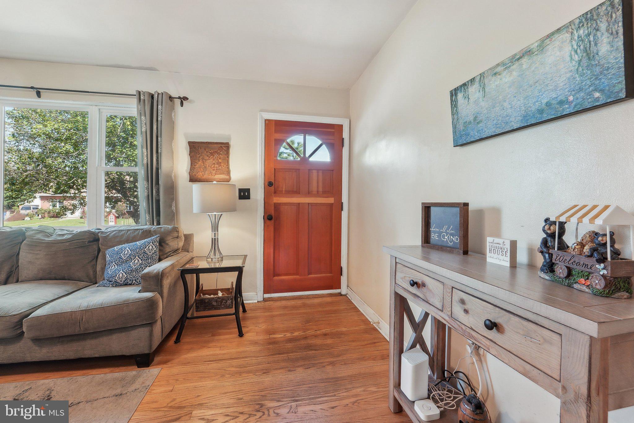 414 Biggs Avenue Frederick, MD 21702 - Photo 5 of 27 a living room with furniture and a large window