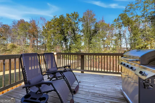 a view of a chairs on wooden deck