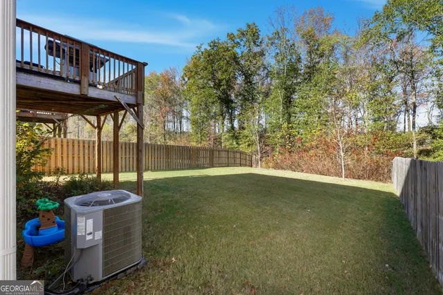 a view of a porch with furniture and garden
