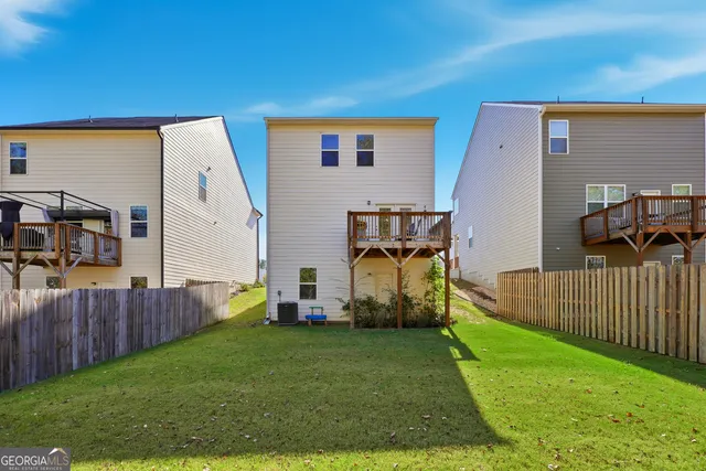 a view of backyard with deck
