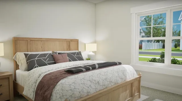 a bedroom with a large bed and a large window