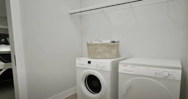 a utility room with dryer and washer