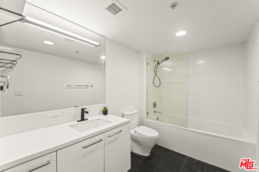 901 Flower Street, Unit 700 Los Angeles, CA 90015 - Photo 22 of 55 a bathroom with a sink a toilet and shower
