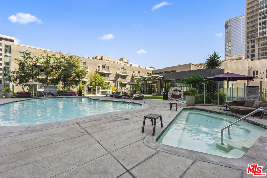 901 Flower Street, Unit 700 Los Angeles, CA 90015 - Photo 25 of 55 a view of a swimming pool with a patio