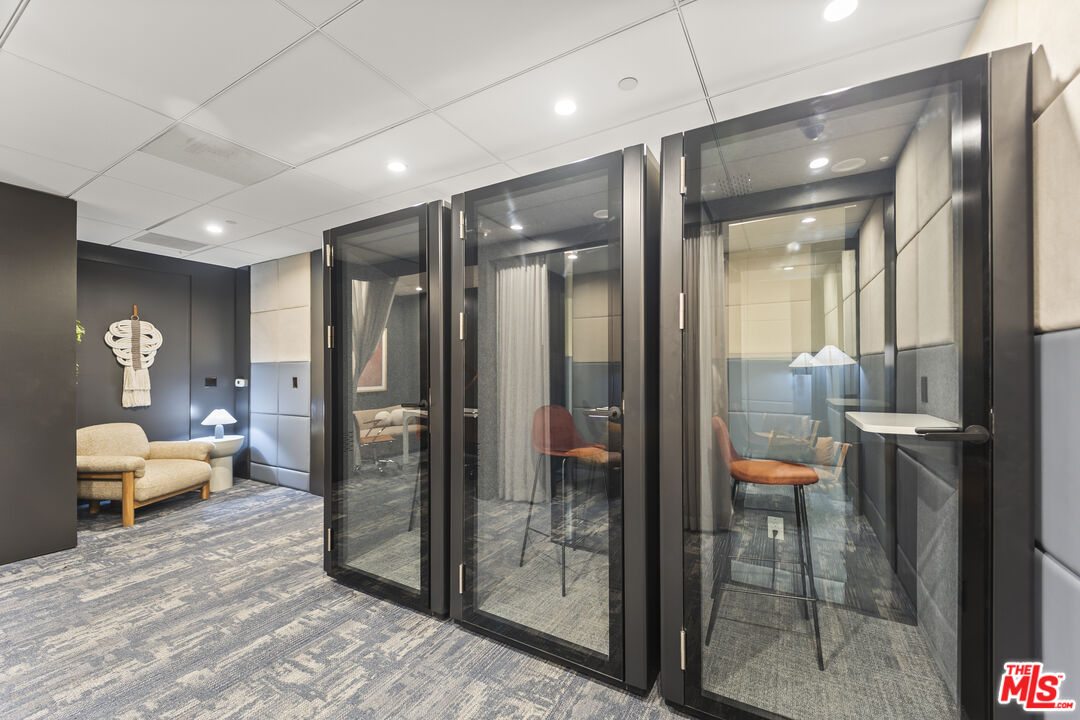 901 Flower Street, Unit 700 Los Angeles, CA 90015 - Photo 44 of 55 a bathroom with a glass door shower and sink