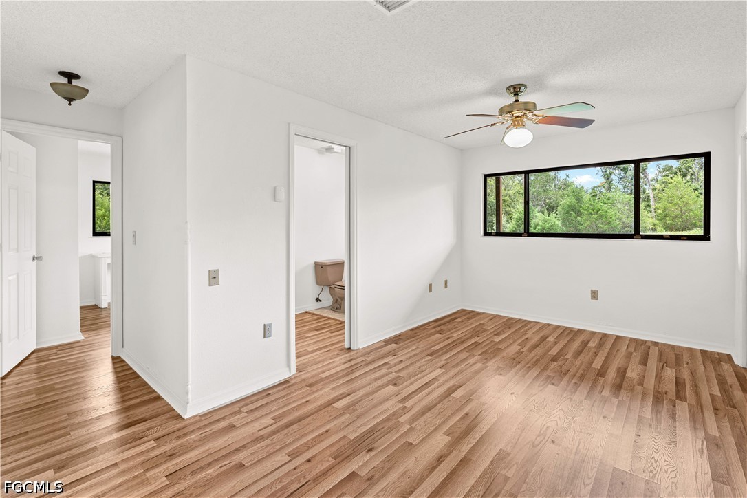 27255 Hickory Hill Road Brooksville, FL 34602 - Photo 34 of 50 a view of empty room with wooden floor and fan