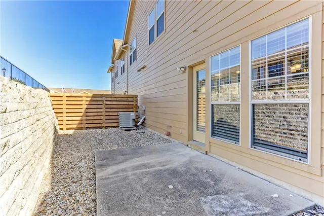 a view of a house with iron fence