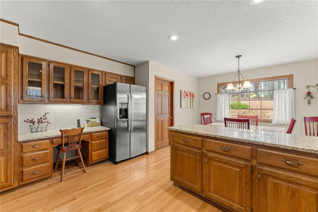 3585 Ridgewood Point Gainesville, GA 30504 - Photo 13 of 41 a kitchen with stainless steel appliances granite countertop a refrigerator and a stove top oven