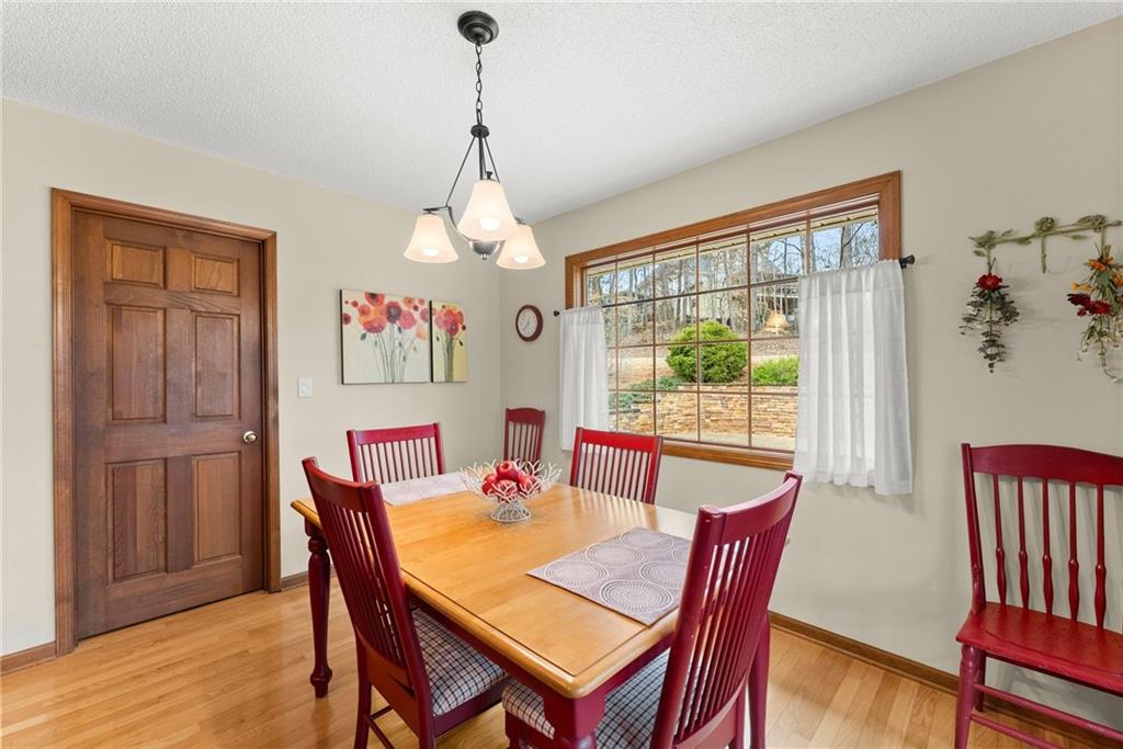 3585 Ridgewood Point Gainesville, GA 30504 - Photo 14 of 41 a view of a dining room with furniture window and wooden floor