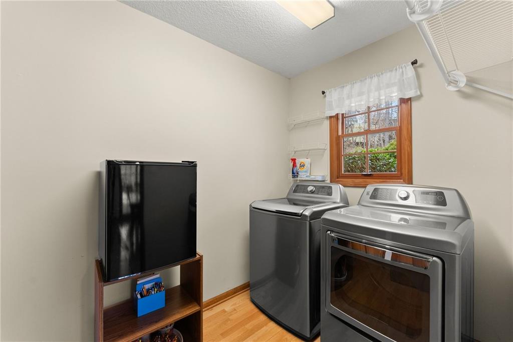 3585 Ridgewood Point Gainesville, GA 30504 - Photo 16 of 41 a view of a storage and utility room with washer and dryer