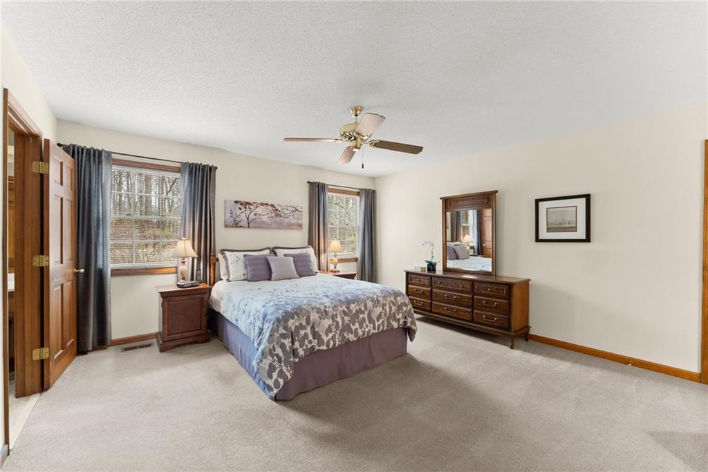 3585 Ridgewood Point Gainesville, GA 30504 - Photo 19 of 41 a bedroom with a bed dresser and window