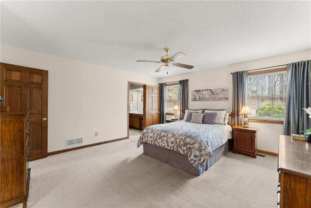 3585 Ridgewood Point Gainesville, GA 30504 - Photo 20 of 41 a spacious bedroom with a bed and a large window