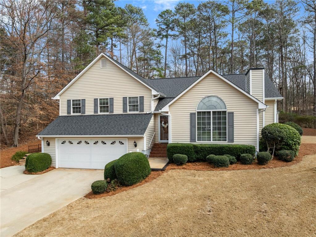3585 Ridgewood Point Gainesville, GA 30504 - Photo 2 of 41 a front view of a house with a yard