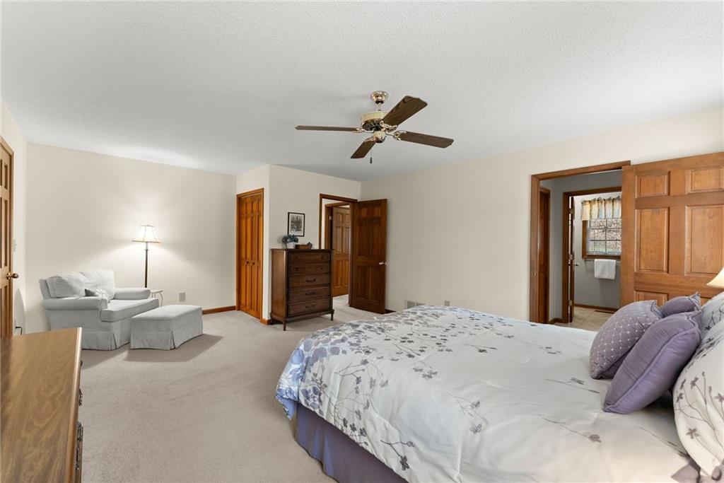 3585 Ridgewood Point Gainesville, GA 30504 - Photo 21 of 41 a bed room with a bed and a chandelier