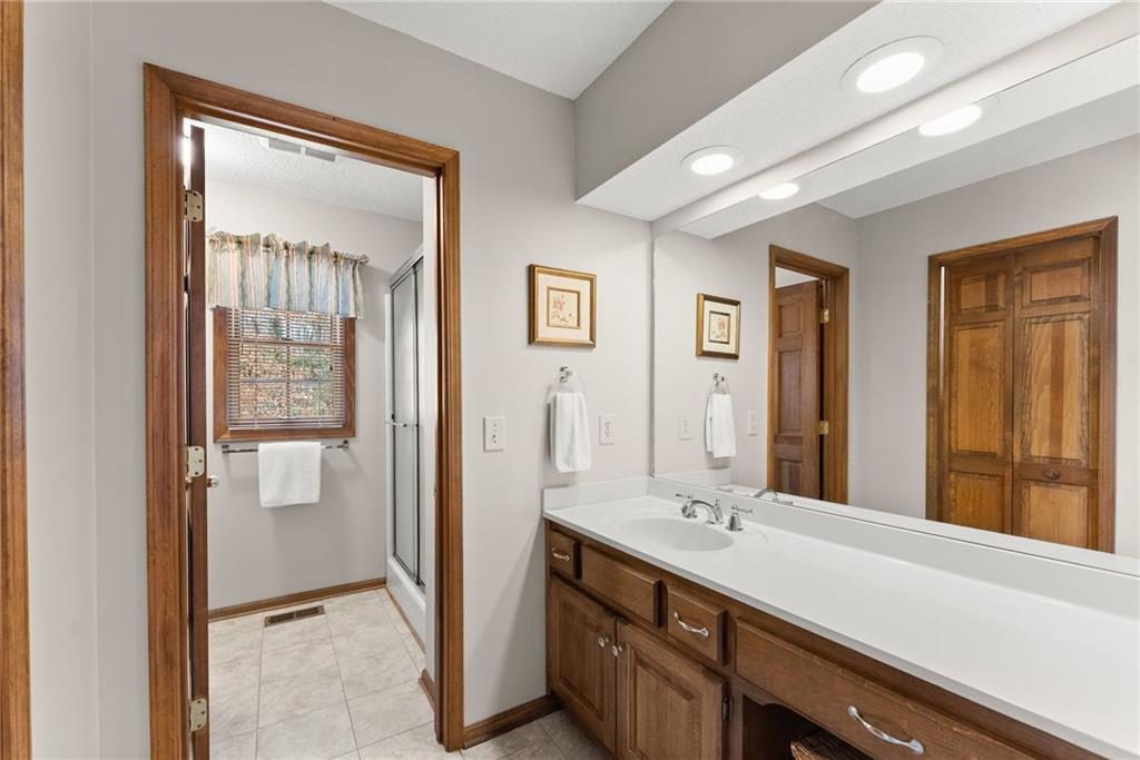 3585 Ridgewood Point Gainesville, GA 30504 - Photo 22 of 41 a bathroom with a double vanity sink and mirror