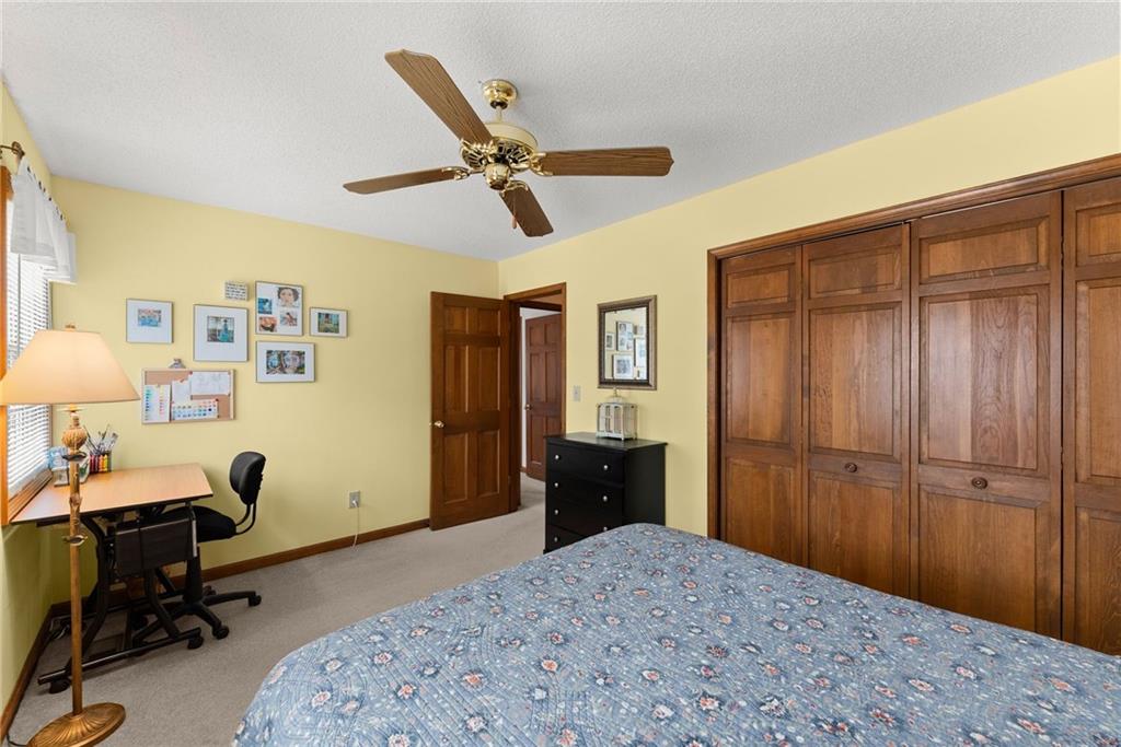 3585 Ridgewood Point Gainesville, GA 30504 - Photo 24 of 41 a bedroom with a bed and a chandelier